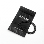 Man wearing stainless steel black cuban bracelet mens streetwear style