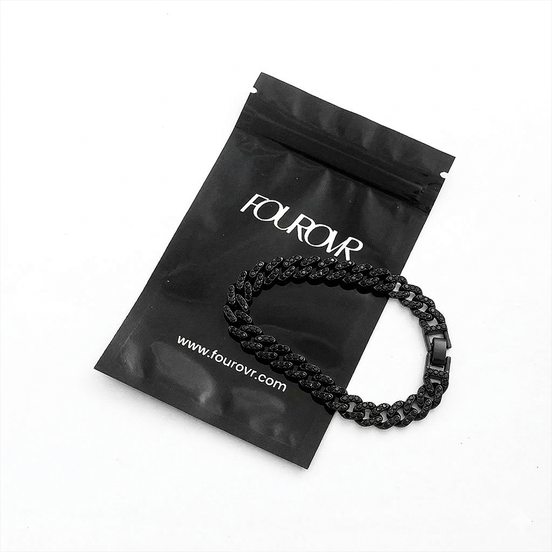 Man wearing stainless steel black cuban bracelet mens streetwear style