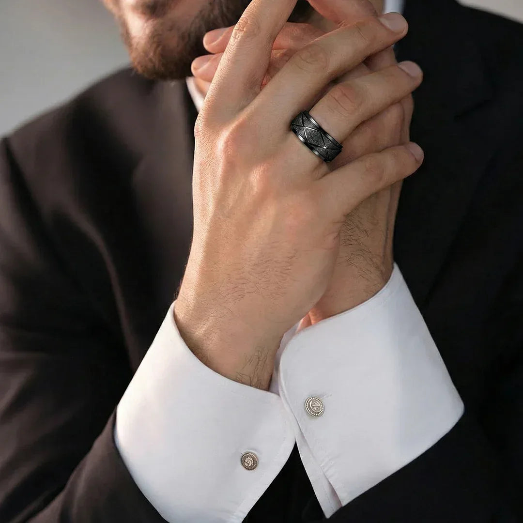 Close up of textured matte black ring for men with geometric X grooves